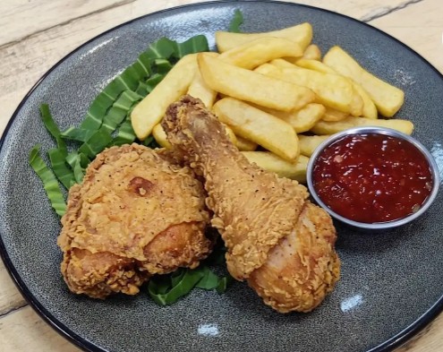 Two fried chicken with chips